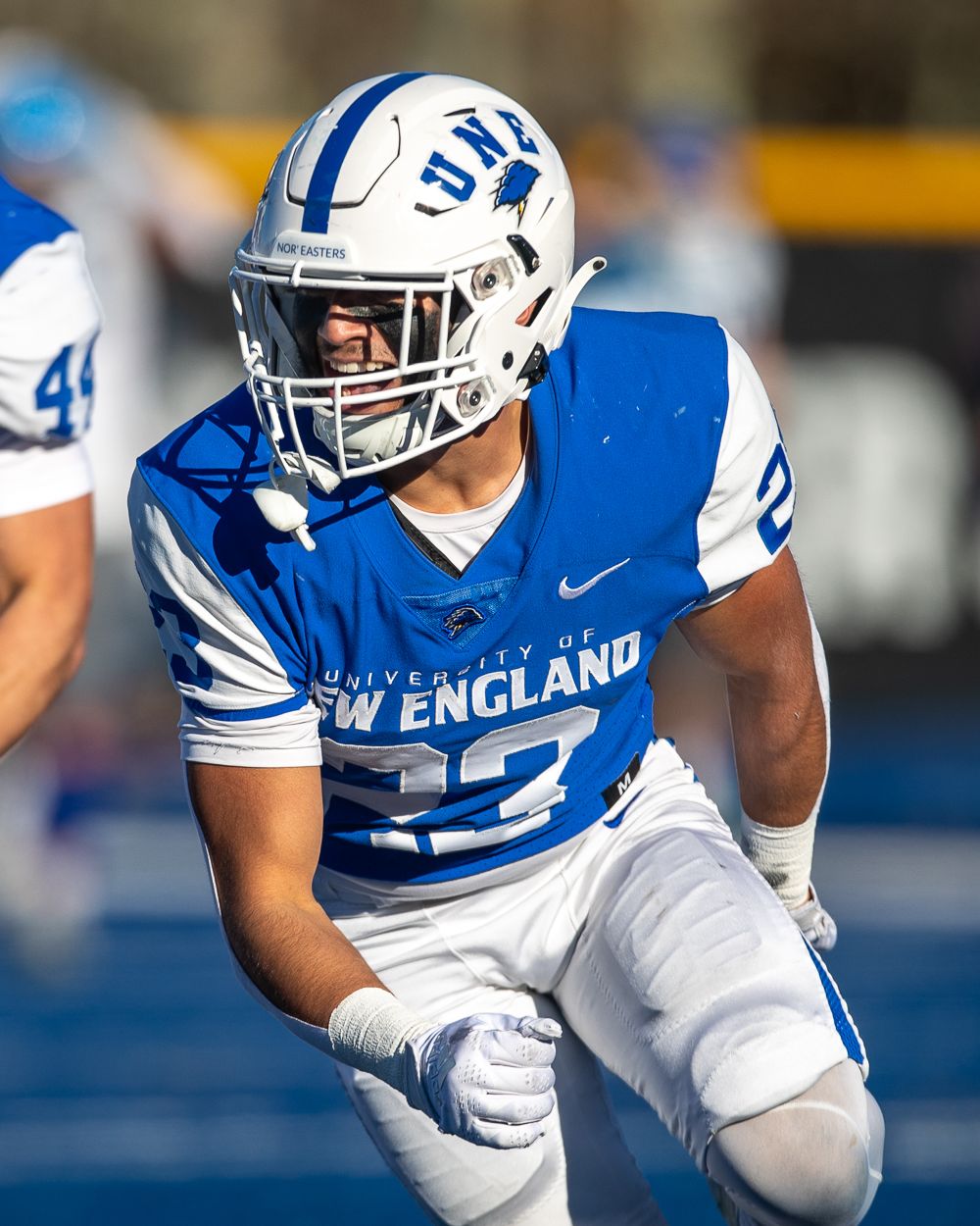 Chris playing college football for the University of New England